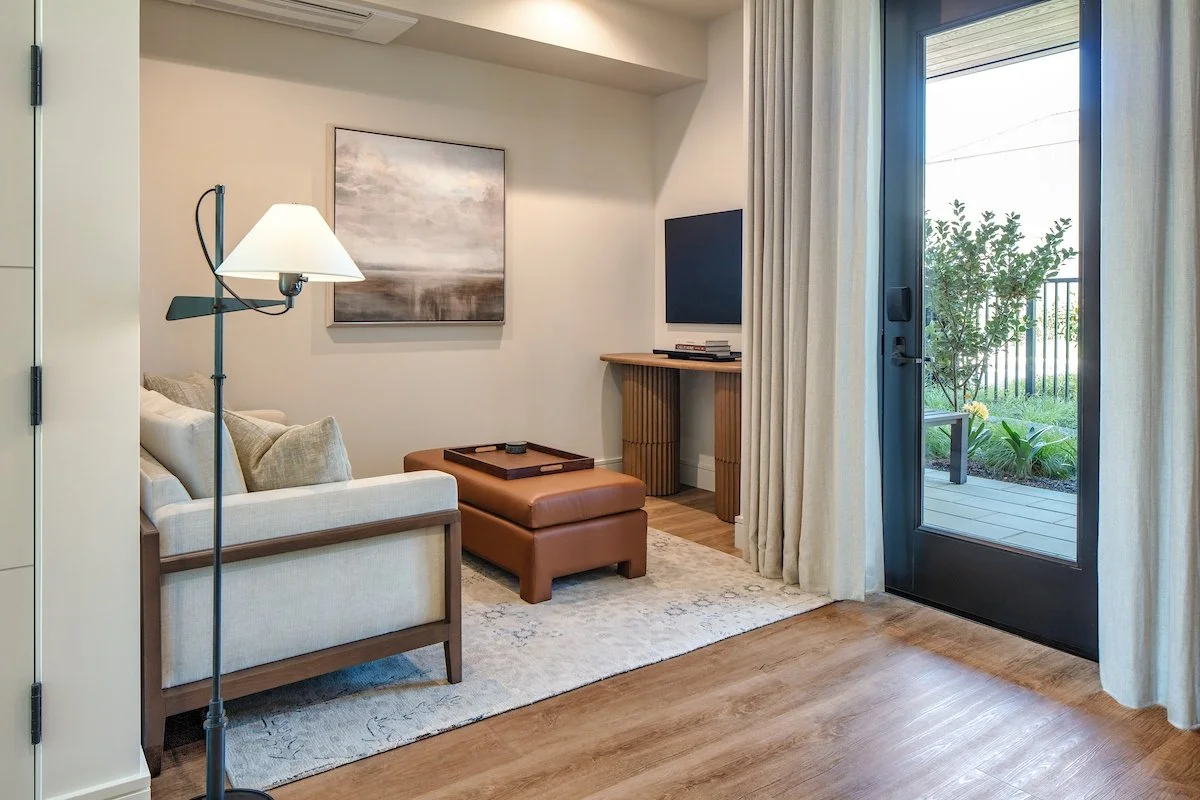 Suite living room with private patio at Duchamp Hotel
